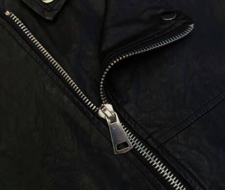 Image of a zipper on a leather jacket.